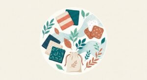 Produits réutilisables du quotidien disposés en cercle : éponges lavables, cotons et mouchoirs en tissu